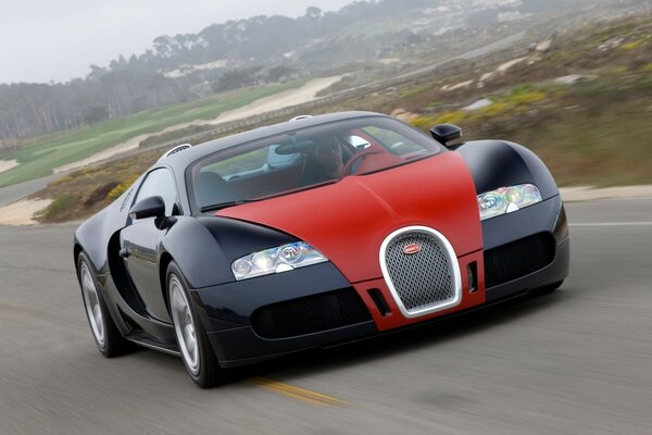 Жарнамадағы қара Bugatti көлігі