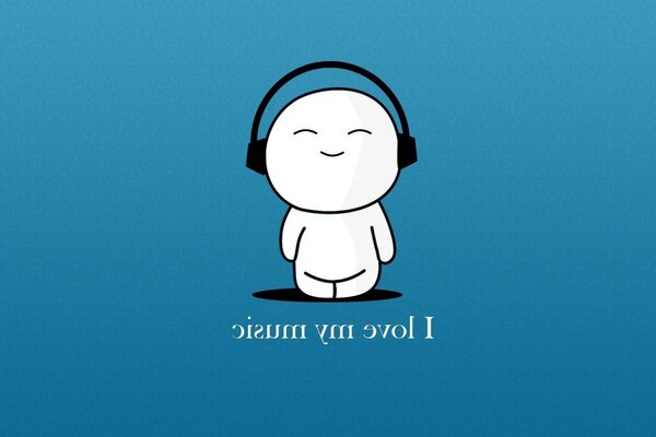 Кішкентай адам құлаққапта музыка тыңдайды